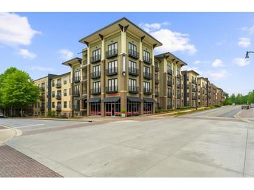 Beautiful apartment building featuring a mix of earth-toned sidings and multiple balconies, creating an inviting exterior at 5300 Peachtree Rd # 1608, Chamblee, GA 30341