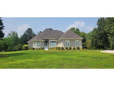 Charming one-story home features a well manicured lawn and a welcoming entrance at 5690 Rutland Trce, Lithonia, GA 30058