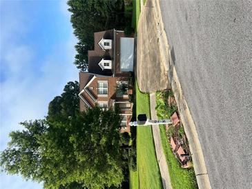 Charming brick home boasts a two-car garage and a beautifully landscaped front yard, offering great curb appeal at 978 Francis Ln, Fairburn, GA 30213