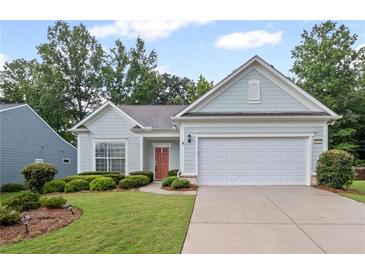 Charming home featuring manicured landscaping, a two-car garage, and inviting curb appeal at 4322 Braden Nw Ln, Kennesaw, GA 30144