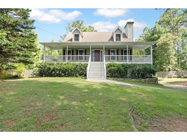 Charming home with a welcoming front porch and well-maintained lawn at 98 Little John Way, Douglasville, GA 30134