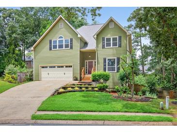 Charming two-story home with a well-manicured lawn and inviting curb appeal at 1876 Hamby Place Nw Dr, Acworth, GA 30102