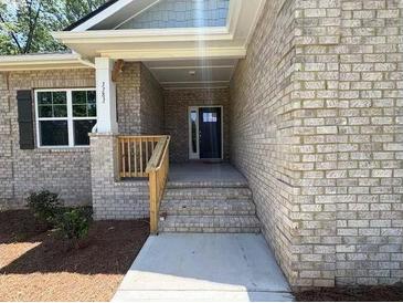 Brick house featuring a covered front entrance and large window at 3402 Milan Ct, Douglasville, GA 30135