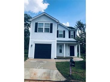 Charming two-story home with dark shutters and a beautifully maintained yard at 1188 To Lani Path, Stone Mountain, GA 30083