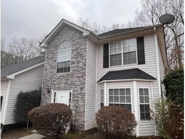 Charming two-story home featuring stone accents, vinyl siding, updated windows, and a well-maintained front yard at 2917 Duncan Pl, Decatur, GA 30034