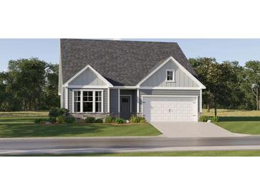Charming single-Gathering home featuring a well-manicured lawn, attached garage, and inviting entrance at 53 Mayhaw Pt, Sharpsburg, GA 30277