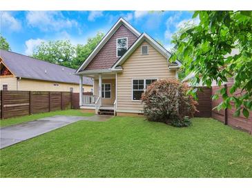 Charming craftsman-style home with a well-manicured front yard and inviting porch at 2005 Chicago Nw Ave, Atlanta, GA 30314