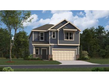Charming two-story home featuring a modern design, two-car garage, and complemented by a well-manicured lawn and lush landscaping at 1400 Hunter Trl, Acworth, GA 30102