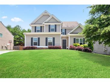 Charming two-story home with manicured lawn and lush landscaping at 405 Blue Sky Circle Cir, Acworth, GA 30102