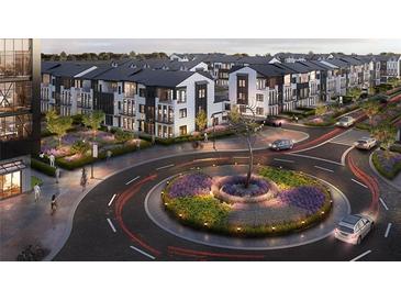 Charming community with modern townhomes, a roundabout, and beautiful landscaping creates a welcoming atmosphere at 5102 Hartwell Pl, Alpharetta, GA 30009