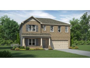 Charming two-story brick home with a well-manicured lawn and attached two-car garage at 516 Almere Dr, Hampton, GA 30228