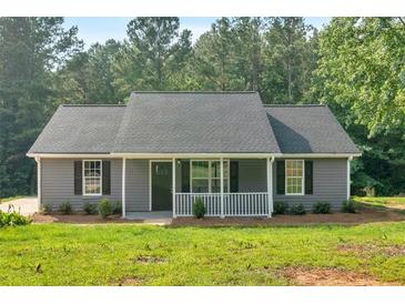 Charming single-story home with gray siding, black shutters and well-manicured lawn at 69 Southern Trace Way, Rockmart, GA 30153