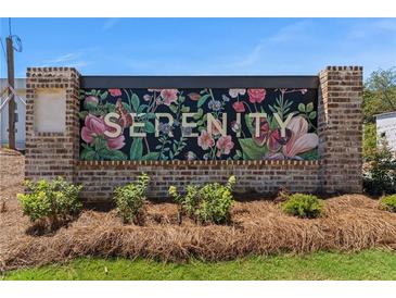 A welcoming community sign with floral design and the word Serenity at 925 Willingham Dr # 13, Hapeville, GA 30354