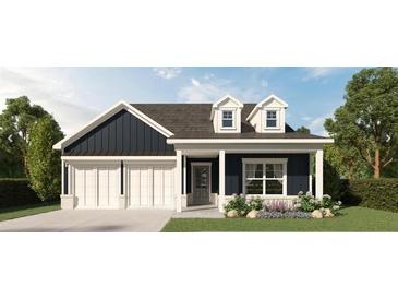 Charming home with white trim, two-car garage, and dormer windows at 400 Vinca Nw Cir, Kennesaw, GA 30144