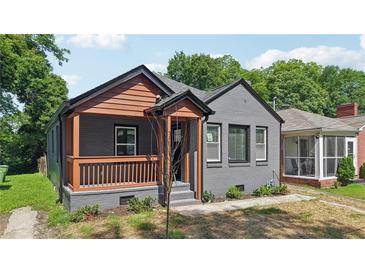 Charming gray brick bungalow with a covered front porch and well-maintained landscaping at 524 Paines Nw Ave, Atlanta, GA 30318