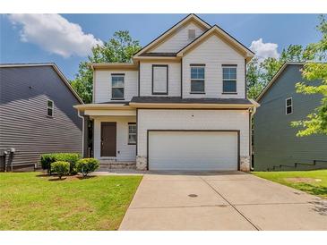 Charming two-story home featuring a two-car garage, well-maintained lawn and craftsman-style details at 173 Parkview Place Dr, Mcdonough, GA 30253
