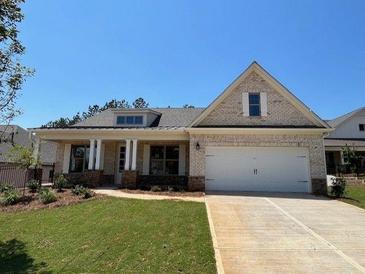 Charming, new construction, one-story home with a welcoming front porch and attached two-car garage at 341 Brooke View Trail, Canton, GA 30115