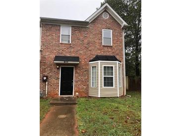 Charming two-story brick home with well-maintained landscaping and a welcoming front entrance at 776 Crestside Ct, Austell, GA 30168
