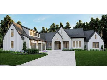 Stunning new build boasts a three-car garage, stone facade, and lush landscaping at 4585 Ryker Rd, Cumming, GA 30041