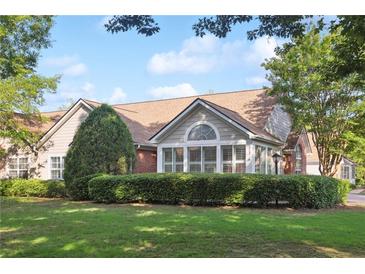 Charming one-story home with brick and siding, manicured lawn, and mature trees in a well-kept neighborhood at 3707 Vineyards Lake Nw Cir # 22, Kennesaw, GA 30144