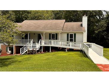 Charming single Gathering home with lush lawn, ramp access, and inviting front porch at 5904 Clairmont Way, Powder Springs, GA 30127