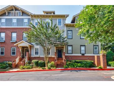 Charming townhouse exterior with brick accents and landscaped entrance at 655 Mead Se St # 3, Atlanta, GA 30312
