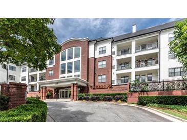 A beautiful building exterior with manicured landscaping and brick facade at 3275 Lenox Ne Rd # 413, Atlanta, GA 30324