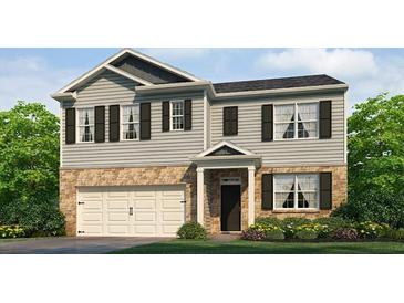 Charming two-story home featuring stone accents, gray siding, black shutters, and an attached two-car garage at 104 Crooked Lake Park, Villa Rica, GA 30180