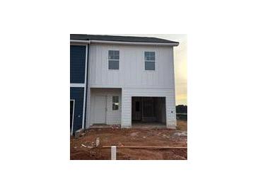 New two-story home featuring a single-car garage, white siding, and classic windows at 1344 Riverstone Rd # 108, Jonesboro, GA 30238