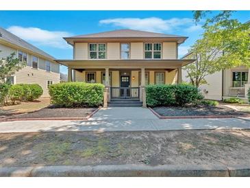 Charming two-story home features a welcoming front porch and well-maintained landscaping at 3278 Shakerley Park, Douglasville, GA 30135