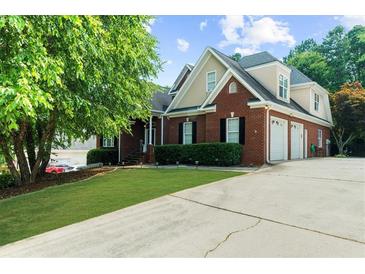 Charming two-story brick home with well-maintained lawn and an attached two-car garage at 3737 Falls Trl, Winston, GA 30187