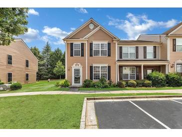 Charming two-story townhouse with black shutters and a well-maintained front lawn at 3028 Sw Deerborne Court Sw Ct, Atlanta, GA 30331