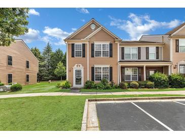 Charming townhome with neutral siding, black shutters, and well-maintained landscaping at 3028 Sw Deerborne Court Sw Ct, Atlanta, GA 30331