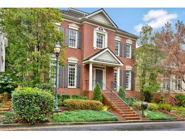 Charming brick home with lush landscaping, gray shutters, and a welcoming front entrance at 49 Conifer Park Ln, Atlanta, GA 30342