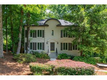 Charming two-story traditional home with well-manicured landscaping and shuttered windows at 799 Birds Se Ml, Marietta, GA 30067