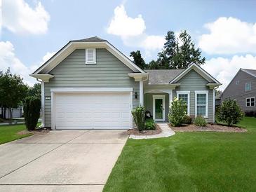 Charming single-story home with a well-manicured lawn, attached two-car garage, and inviting curb appeal at 2871 Goldfinch Cir, Marietta, GA 30066