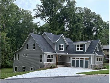 Charming two-story home with a two car garage, well-manicured lawn, and craftsman-style architectural details at 331 Terrell Sw Dr, Marietta, GA 30064