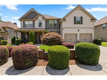 Beautiful two-story home boasts manicured landscaping and a welcoming two-car garage at 2602 Corey Park Dr, Loganville, GA 30052