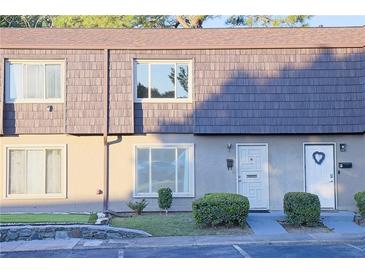 Charming townhome featuring a stylish shingle facade, neutral stucco, and well-maintained landscaping at 1818 Ashborough Cir # E, Marietta, GA 30067