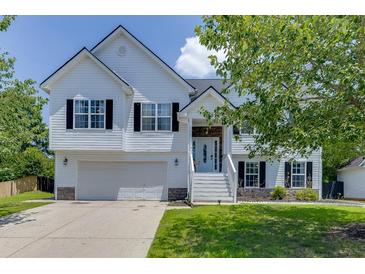 Charming two-story home with white siding, black shutters, and a well-maintained front yard at 3153 Morgan Box Ne Ln, Buford, GA 30519