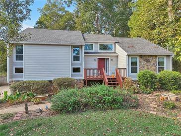 Charming two-story home with a welcoming front porch and beautiful landscaping at 2653 Partridge Trl, Duluth, GA 30097