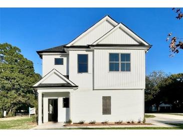 Charming two-story home featuring a white exterior and black accents at 12 Confederate Nw St, Cartersville, GA 30121