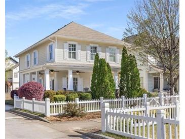 Charming two-story home with white picket fence and manicured landscaping at 1370 Dupont Nw Park, Atlanta, GA 30318
