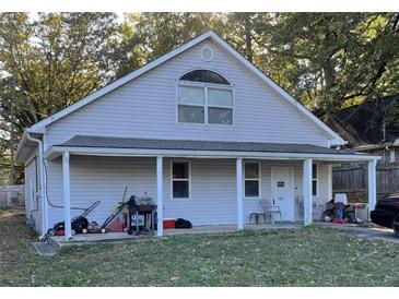 Charming single Gathering home with a covered front porch and a well maintained yard at 4004 Campbellton Rd, Atlanta, GA 30331