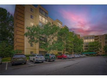 Spacious, modern condo building with assigned parking surrounded by mature shade trees at 1800 Clairmont Lk # A310, Decatur, GA 30033