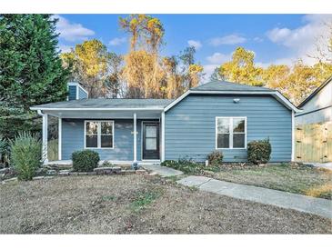 Charming blue single-story home with a cozy front porch and well-kept landscaping at 3918 S Creek Ct, Stone Mountain, GA 30083