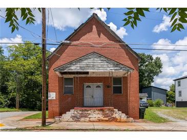 Unique brick building with a covered entryway and potential for renovation at 88 Martin Se Ave, Atlanta, GA 30315