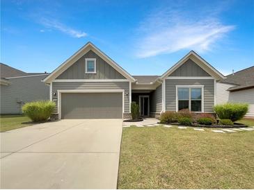 Charming one-story home featuring a two-car garage and beautifully landscaped front yard at 2838 Menton Rd, Powder Springs, GA 30127
