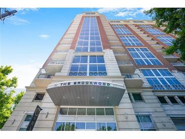 Stunning exterior view of The Brookwood building, showcasing modern architectural design and a prominent entrance at 1820 Peachtree Nw St # 1008, Atlanta, GA 30309