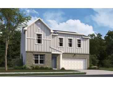 Charming two-story home with brick and siding, a front-entry garage, and a well-maintained lawn at 133 Bandimere Pkwy, Dallas, GA 30157
